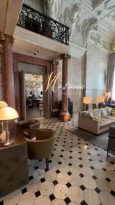 A short, visually focused montage showcasing the opulent interior and dining atmosphere of Berners Tavern in London, featuring shots of the bar, dining room, and table settings.
