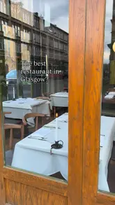 A visually compelling review of a high-end restaurant in Glasgow, featuring close-ups of expertly plated dishes, the kitchen team at work, and the elegant dining room interior. The video uses text overlays to guide the viewer through the menu highlights and the overall dining experience.