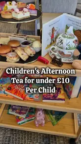 A promotional video for a children's afternoon tea experience at the DoubleTree by Hilton, West End, featuring a roaming book trolley and themed treats.