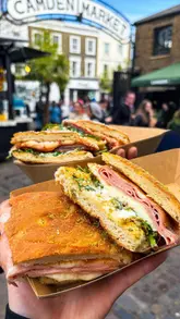 A fast-paced, engaging review of a street food stall in Camden Market, showcasing the preparation and consumption of two signature focaccia paninis.