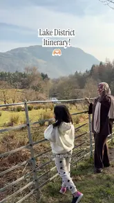 A family travel vlog documenting a short itinerary in the Lake District, featuring visits to Aira Force waterfall, scenic drives, and a stop at a halal fish and chip shop called The Codfather in Ambleside, followed by a visit to Lowther Castle.