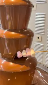 A vlog-style video showcasing a visit to Little Cosmo, an all-you-can-eat buffet restaurant. The video features shots of the entrance, the various food stations, the plating of dishes like duck pancakes and ribs, and the dessert section including a chocolate fountain and ice cream.