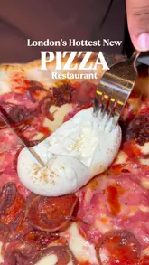 A short, punchy montage showcasing various pizzas, starters, and desserts at a London pizza restaurant, set to music with text overlays highlighting the venue.