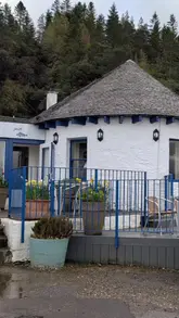 A montage video showcasing The Pierhouse Hotel in Port Appin, featuring shots of the hotel exterior, a guest room, the restaurant interior, seafood dishes, and the surrounding coastal scenery.