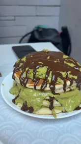 A review of 'Hidden Gem Cafe' in Bellshill, highlighting their afternoon tea and the viral Dubai chocolate pancake trend. The video takes the viewer through the exterior, interior, menu, and a close-up look at the food.