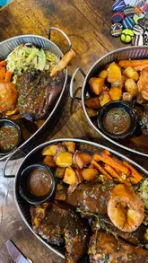 A review of a Sunday roast and bottomless cocktail experience at a venue called The Tropical in New Cross. The video features shots of the interior decor, the roast dinner, and the cocktails, accompanied by a voiceover explaining the £50 deal.