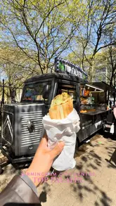 A fast-paced, handheld-style video showcasing 'Top Falafel,' a popular street food stall in Birmingham city centre. The video highlights the queue, the menu, the fresh preparation of falafel and juices, and the final food items (lunchbox and wrap).