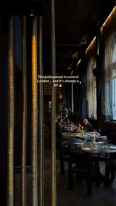 A cinematic showcase of a newly opened, upscale Greek-Mediterranean restaurant in London. The video features slow, deliberate pans of the moody, candlelit interior, close-ups of refined dishes like tuna tartare and lobster risotto, and shots of unique cocktails being prepared and served. The editing is smooth and atmospheric, focusing on the aesthetic experience of the venue.