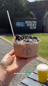 A vlog-style review of 'The Shack' in Royal William Yard, showcasing their smoothie bowls, matcha, and vegan cakes.