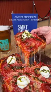 A high-quality food showcase featuring Detroit-style pizza, fried potatoes, fried olives, and beer at Corner Shop Pizza in Saint Paul's Market, Birmingham. The video focuses on close-up shots of the food, including a cheese pull, to highlight the textures and quality of the dishes.