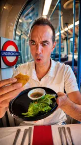 The creator visits 'Supperclub Tube' in London, a restaurant located inside a vintage 1967 London Underground carriage. The video features a tour of the unique venue, followed by a review of a six-course Latin American tasting menu, including empanadas, causa, ceviche, carnitas, and desserts.