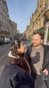 A fast-paced travel vlog documenting a day trip to Edinburgh, featuring sightseeing at the castle, cocktails at a themed bar, and dinner at a food market.
