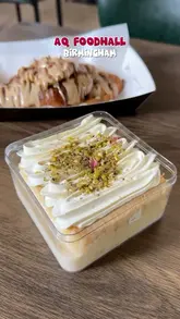 A short video showcasing desserts and drinks at AQ Foodhall in Birmingham, featuring a croissant, a milk cake, and a matcha latte.