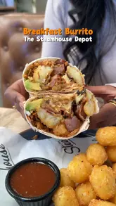 A short, engaging reel showcasing a breakfast burrito, tater tots, a drink, and a cookie at The Steamhouse Depot, featuring the creator trying the food.