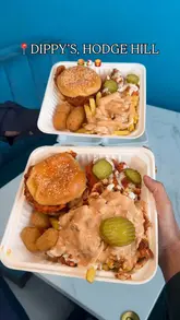 A short video review of Dippy's in Hodge Hill, showcasing various 'munchboxes' containing burgers, tenders, fries, and milkshakes. The video features a quick shot of the interior followed by a series of close-ups of the food boxes.