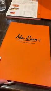 A couple visits Ma Eum, a Korean restaurant in Westminster, to review a variety of dishes including Korean fried chicken, dumplings, seafood pancake, and soy marinated crab bibimbap. The video features voiceover commentary, close-ups of the food, and reactions to the meal.