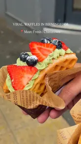 A short, handheld video showcasing two dessert waffles and a drink from Meet Fresh in Birmingham's Chinatown. The video focuses on the visual appeal of the food items, using close-up shots to highlight the toppings and preparation.