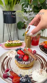 A short, high-quality promotional video for Elysiaan cafe in Moseley, Birmingham, featuring a variety of brunch dishes including pancakes, eggs benedict, and pastries. The video uses slow-motion shots and bright lighting to create an inviting atmosphere.