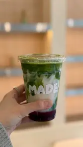 A short promotional video for a new cafe called MADE in Leeds, featuring shots of the exterior, the menu board, a matcha drink, and the interior decor.