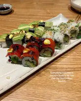 A top-down shot of a sushi platter from Sticks'n'Sushi, featuring various rolls and nigiri, with text overlay describing the bottomless brunch offer.