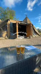 A montage video showcasing a tipi venue located on an estate, highlighting the outdoor seating, interior decor, wood-fired pizza, cocktails, and live music.