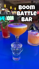 A fast-paced, energetic reel showcasing a visit to Boom Battle Bar, highlighting the various competitive socialising games available, the cocktail menu, and the bar food offerings.