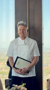 A promotional video showcasing the launch of Bread Street Kitchen at 22 Bishopsgate, featuring Gordon Ramsay. The video highlights the panoramic London views, the upscale interior, and a selection of breakfast dishes including lobster benedict and avocado toast.