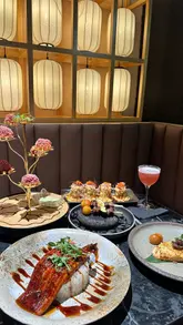 A short, visually focused reel showcasing a Japanese restaurant in London, featuring close-ups of beautifully presented dishes like unagi and skewers, alongside the restaurant's atmospheric interior.