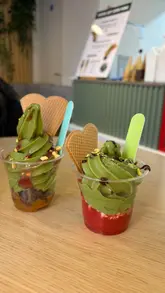 A short, simple video showcasing two matcha soft-serve ice cream options at Suki cafe in Exeter, including a shot of the menu and the cafe exterior.
