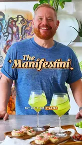 A polished recipe tutorial video featuring a creator preparing a 'Manifestini' (a cucumber and black pepper Hugo Spritz) and radish and butter tartines. The video uses quick cuts, text overlays, and voiceover to guide the viewer through the preparation process in an entertaining, personality-led format.