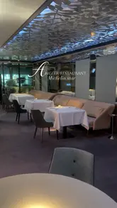 A visually polished showcase of the Michelin-starred Angler restaurant, featuring elegant shots of the dining room, refined plating, and wine service.