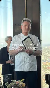 A high-quality, polished video showcasing a breakfast experience at Bread Street Kitchen, 22 Bishopsgate. The video features professional cinematography of various breakfast dishes, including lobster benedict and pancakes, alongside stunning panoramic views of London. Gordon Ramsay makes an appearance, adding to the premium feel of the venue.