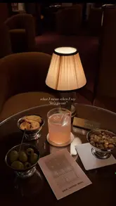 A short, atmospheric montage showcasing the interior and branded details of the Bar Noé pop-up at the Louis Vuitton Hotel in London, featuring cocktails with monogrammed ice cubes and branded snacks.