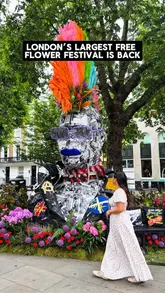 A montage showcasing various floral art installations across Chelsea for the annual Chelsea in Bloom festival. The video highlights different creative displays, including zodiac-themed sculptures and other artistic arrangements, set to music with text overlays providing information about the event dates and location.