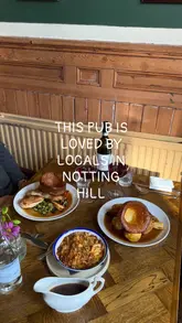 A short, atmospheric video showcasing a local pub in Notting Hill, highlighting its interior, Sunday roast, and dessert offerings.