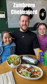 A family-focused vlog showcasing a visit to Zambrero in Chelmsford. The video highlights the assembly line process, the 'Power Burrito' promotion, and various menu items including nachos and burrito bowls, ending with the family enjoying their meal.