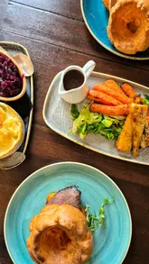 A montage of food and venue shots at The Mortimer Arms, focusing on their Sunday roast offering, including starters and desserts.