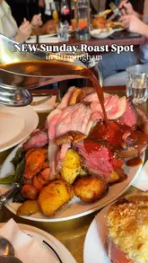 A high-quality, music-led montage showcasing a Sunday roast sharing platter at Blacklock in Birmingham. The video features close-up shots of tender meats, crispy roast potatoes, gravy being poured, a side of mac and cheese, and a white chocolate dessert, effectively highlighting the restaurant's food quality.