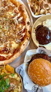 A fast-paced tour of Newport Market, highlighting various food vendors including a burger spot, pizza place, and dessert shop, alongside the arcade and seating areas.