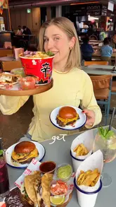 The video is a fast-paced review of Tower Bridge Collective, a food hall in London. The creator highlights the variety of cuisines available, showing off burgers, tacos, ramen, churros, and chocolate drinks. The video emphasizes the venue's location with a view of Tower Bridge and positions it as an ideal spot for groups with diverse food preferences.