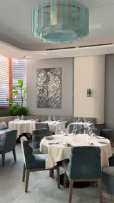 A high-end, cinematic showcase of Pavyllon London, featuring the restaurant's elegant interior, the chefs at work, and a series of beautifully plated dishes.