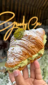 A fast-paced listicle video featuring five different bakeries in London and Liverpool, showcasing various pastries, doughnuts, and cakes with close-up shots of the food being broken open and eaten.