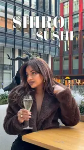 A promotional reel for Shiro Sushi featuring a creator enjoying their bottomless brunch, showcasing various sushi dishes, dumplings, and drinks, while highlighting a Polaroid camera social media competition.