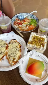 A montage showcasing various food and drink items from different vendors at the Art Quarter food hall in Digbeth, including noodle bowls, lemonade, and desserts.