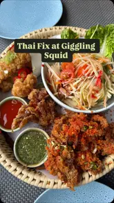 A montage of various Thai dishes served at Giggling Squid, including a seafood sharing platter, green curry, pad thai, and desserts, set to music with text overlays identifying the items.