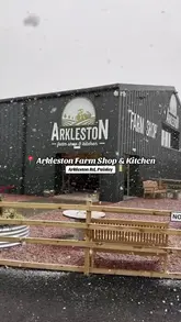 A montage video showcasing the interior of Arkleston Farm Shop & Kitchen, including shots of the breakfast menu, the shop's produce, butcher counter, bakery, and ice cream display.