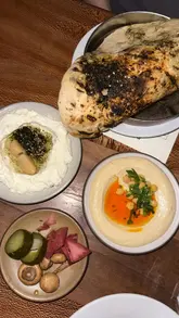 A short, energetic reel showcasing the £39 set menu at Bubala, featuring close-ups of various vegetarian Middle Eastern dishes like hummus, labneh, halloumi, and potato latkes, alongside shots of the kitchen and dining atmosphere.