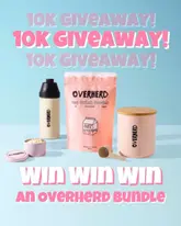 A clean, studio-style promotional image for an Overherd product giveaway, featuring the oat drink powder, a glass bottle, a travel tin, and a storage tin arranged on a light blue surface with bold pink text overlays.