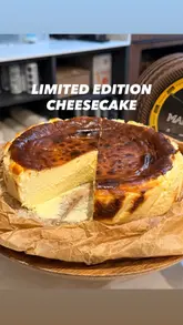 A short, visually appealing video showcasing two limited edition Basque cheesecake flavors (Manchego and Chocolate) at La Maritxu. The video focuses on the texture and cutting of the cakes.