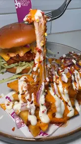 A promotional reel for Ranches in Newcastle, featuring close-up shots of their burgers, loaded fries, rice boxes, and milkshakes, interspersed with clips of the venue's interior and branding.